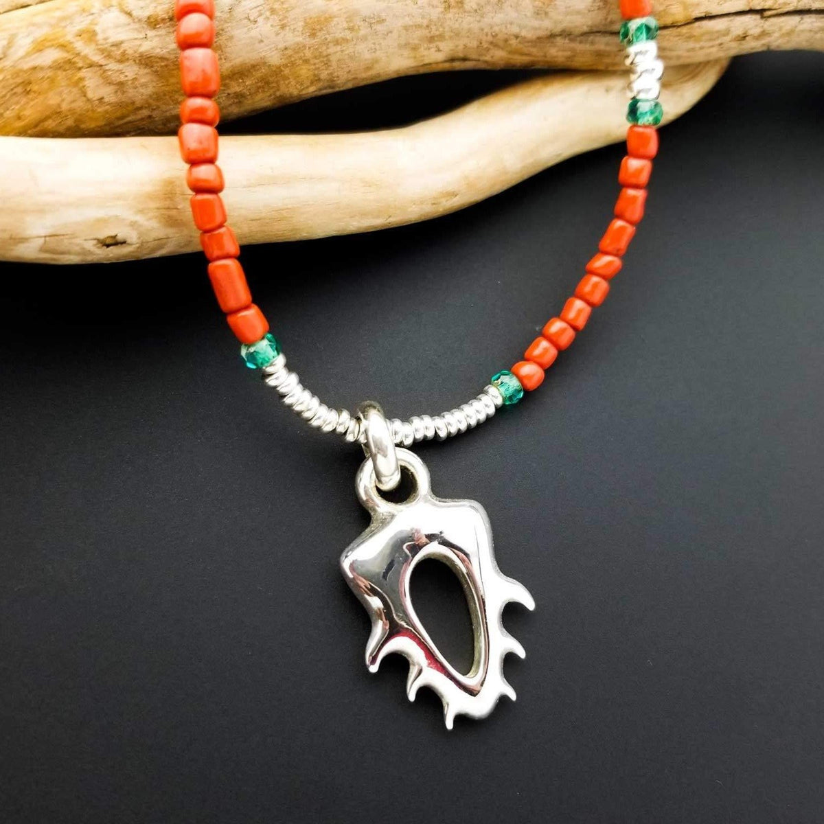 coral looking bead and silver pendant necklace