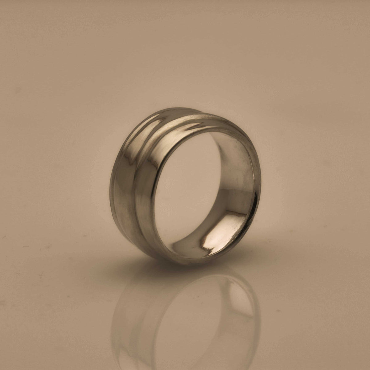 Silver ring with a wave pattern
