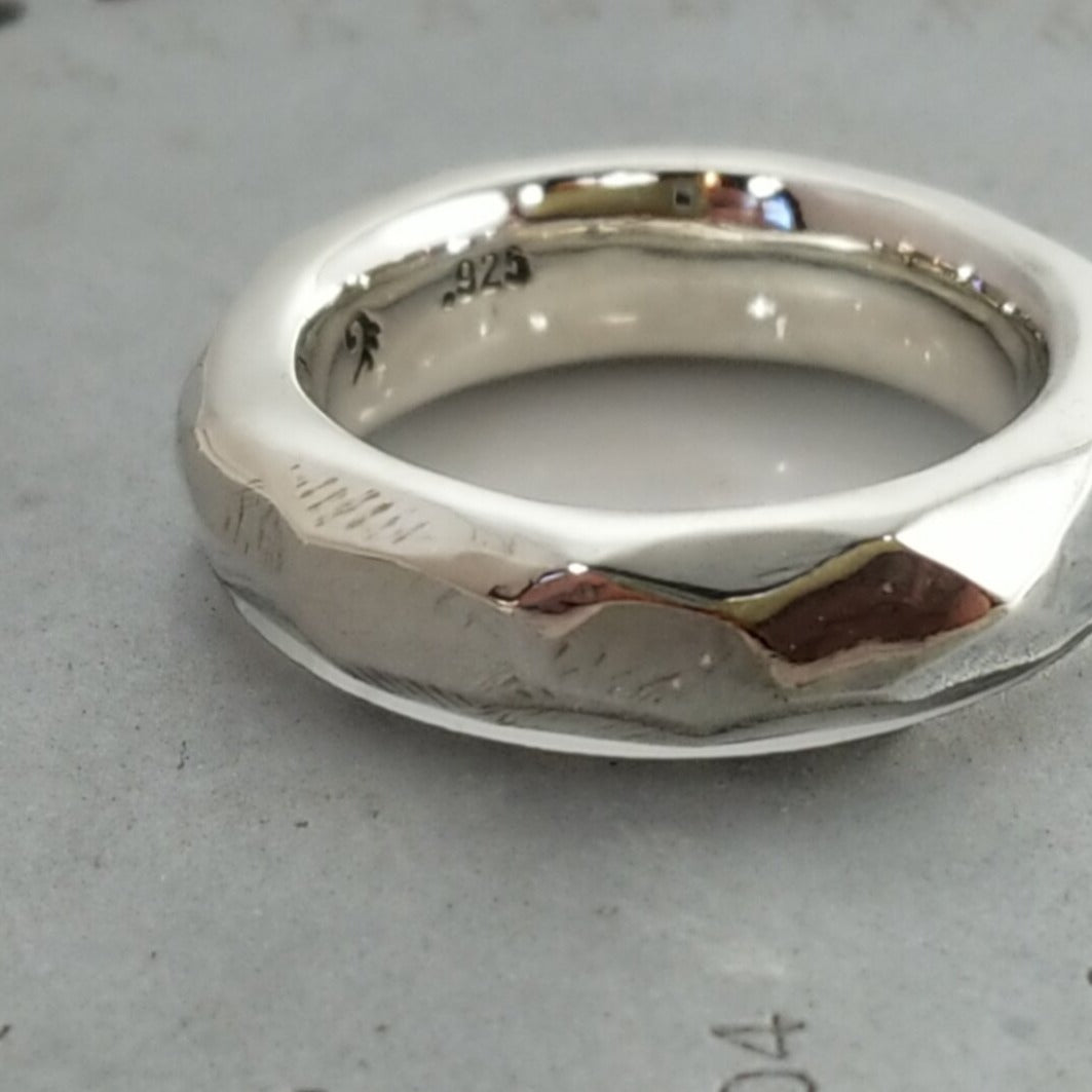 Discover Mr. Edgy: A One-of-a-Kind Solid Silver Ring with a Faceted Surface and Artistic Design - Nine Amulets 