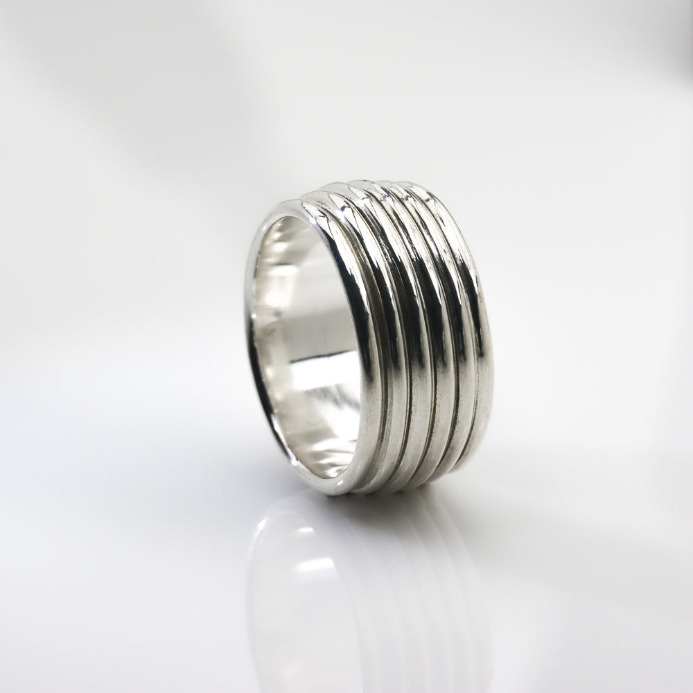 Revolutions: A Bold and Elegant Sterling Silver Ring with Six Loops - Nine Amulets 