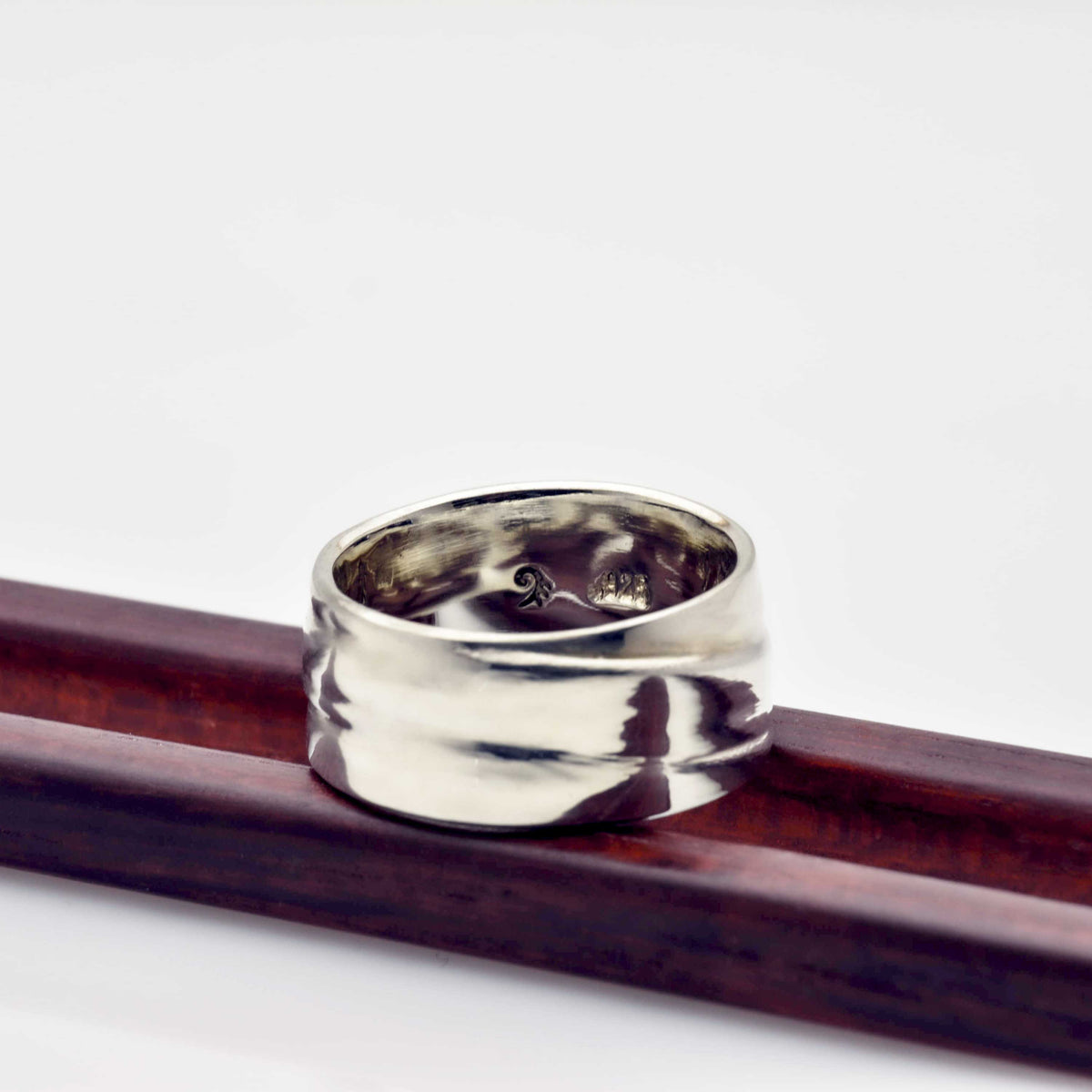 &quot;Wavy Elegance: Sterling Silver Band with a Stunning Pattern Design&quot; - Nine Amulets 