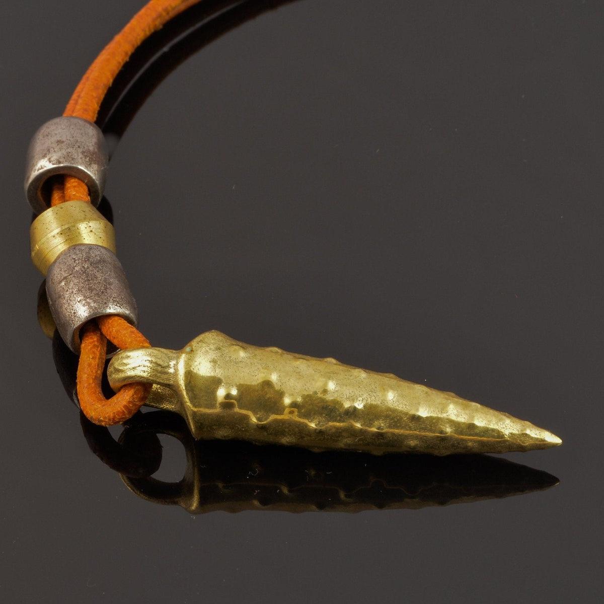Bronze bullet pendant with a tribal look | organic bronze 