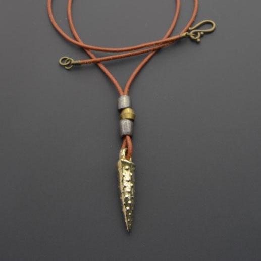 Bronze bullet pendant with a tribal look | organic bronze 