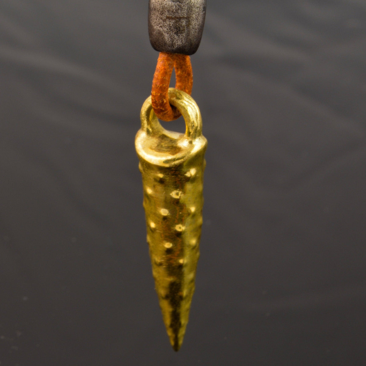 Bronze bullet pendant with a tribal look | organic bronze 