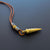 Bronze bullet pendant with a tribal look | organic bronze 