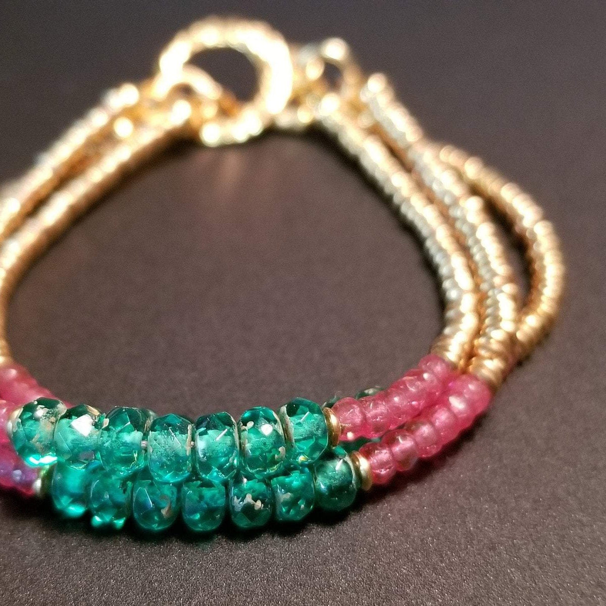 Gold clasp and pink and green bracelet