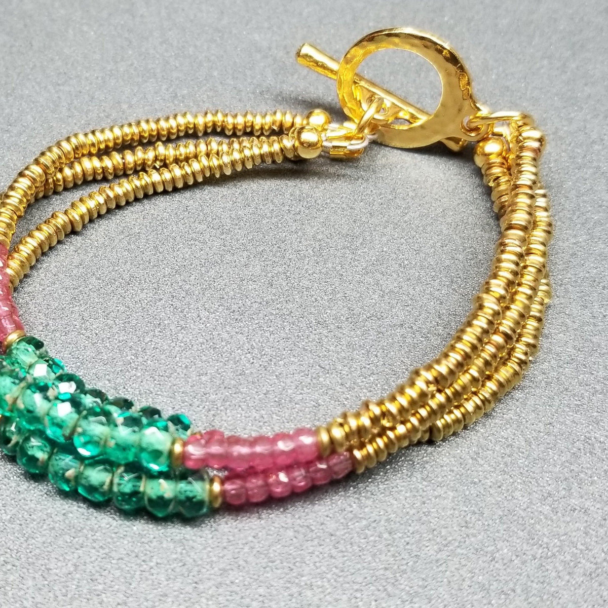 Feminine golden triple strand bracelet