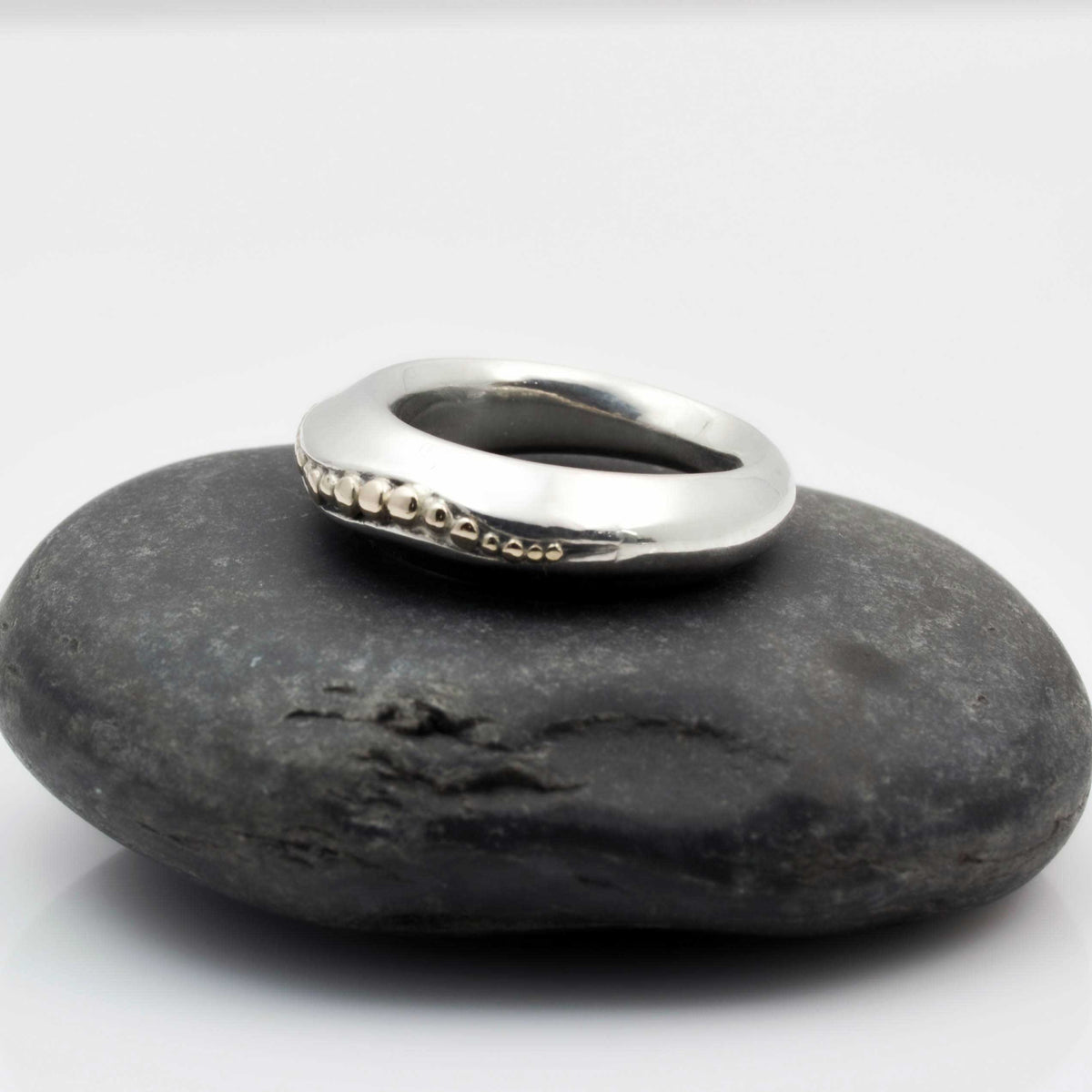 &quot;Golden Spheres: A Unique and Elegant Sterling Silver Ring with 14K Gold Accents&quot; - Nine Amulets 