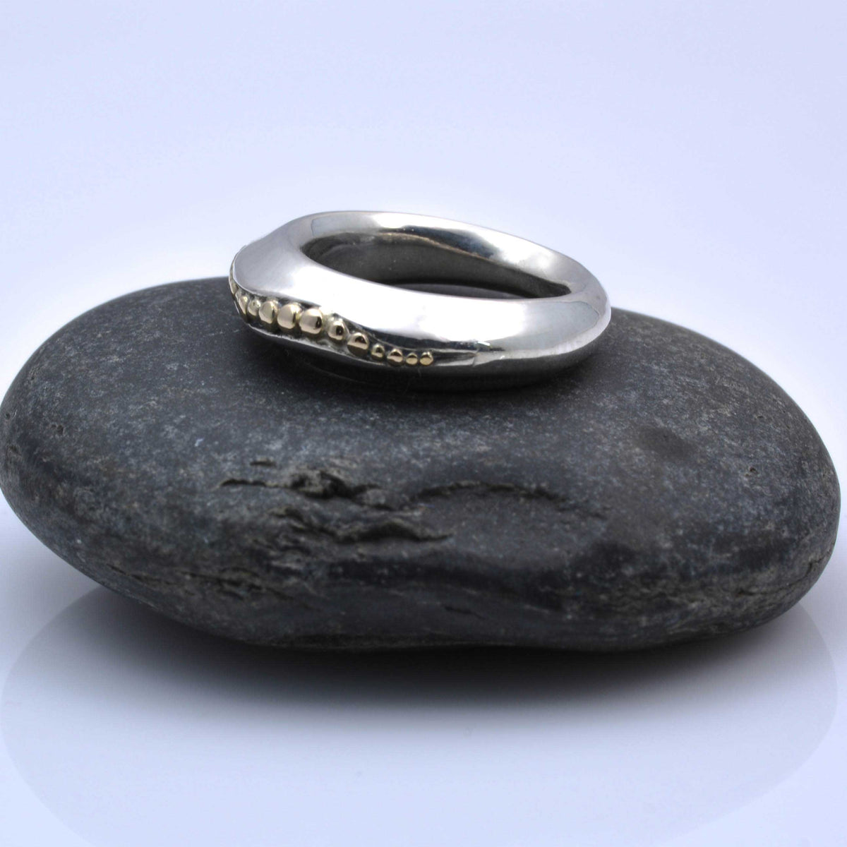 &quot;Golden Spheres: A Unique and Elegant Sterling Silver Ring with 14K Gold Accents&quot; - Nine Amulets 