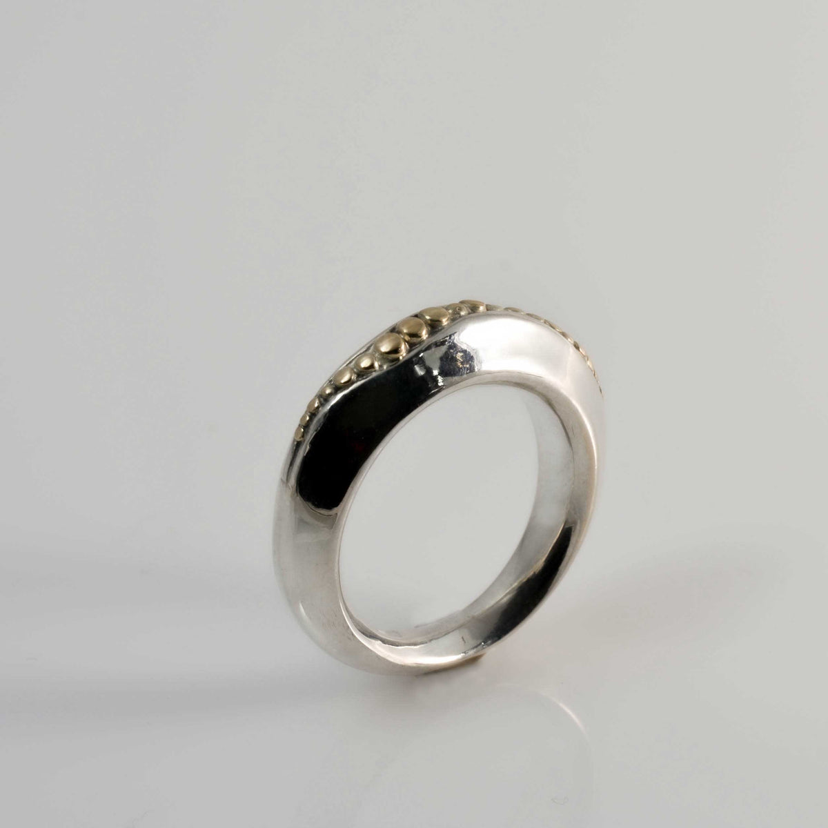 &quot;Golden Spheres: A Unique and Elegant Sterling Silver Ring with 14K Gold Accents&quot; - Nine Amulets 