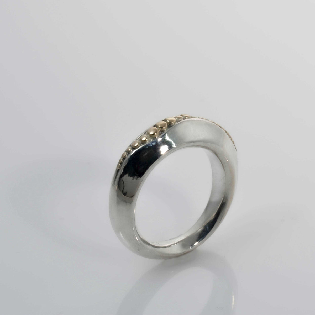&quot;Golden Spheres: A Unique and Elegant Sterling Silver Ring with 14K Gold Accents&quot; - Nine Amulets 