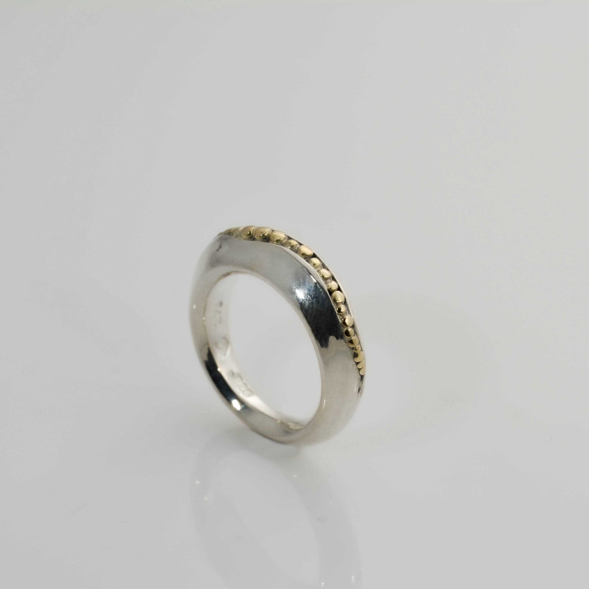 &quot;Golden Spheres: A Unique and Elegant Sterling Silver Ring with 14K Gold Accents&quot; - Nine Amulets 