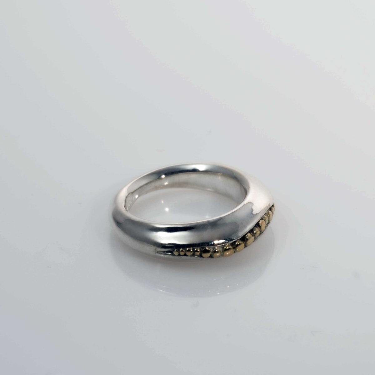&quot;Golden Spheres: A Unique and Elegant Sterling Silver Ring with 14K Gold Accents&quot; - Nine Amulets 
