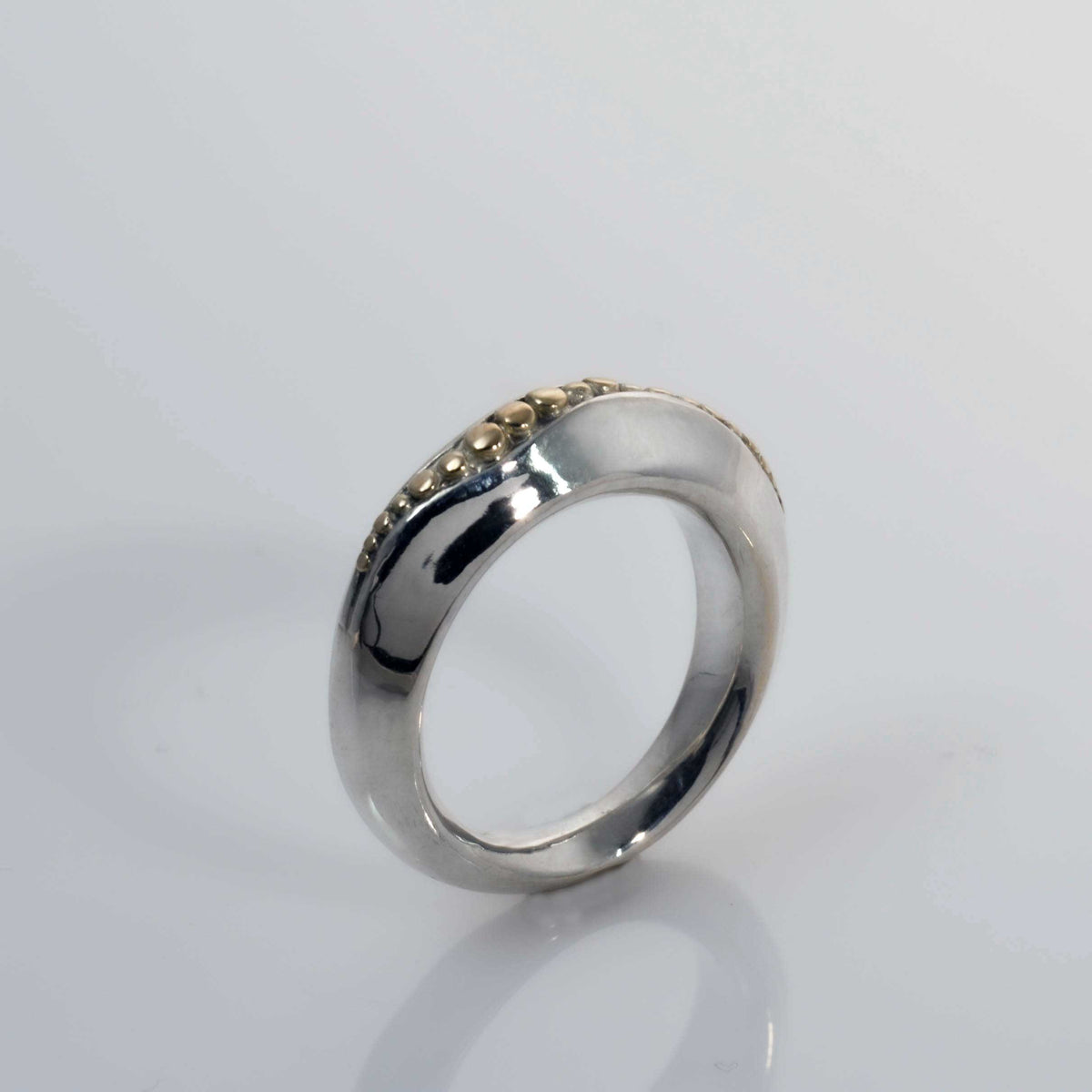 &quot;Golden Spheres: A Unique and Elegant Sterling Silver Ring with 14K Gold Accents&quot; - Nine Amulets 