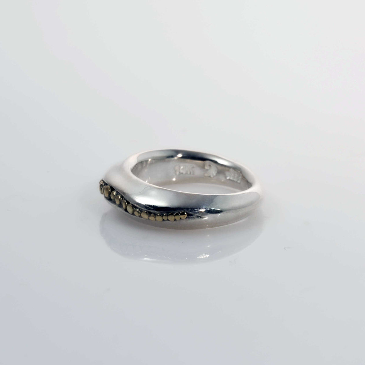 &quot;Golden Spheres: A Unique and Elegant Sterling Silver Ring with 14K Gold Accents&quot; - Nine Amulets 