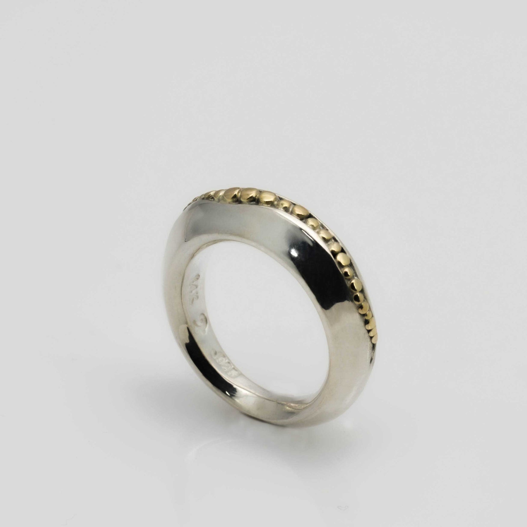 "Golden Spheres: A Unique and Elegant Sterling Silver Ring with 14K Gold Accents" - Nine Amulets 