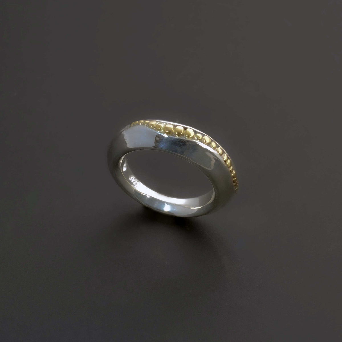 &quot;Golden Spheres: A Unique and Elegant Sterling Silver Ring with 14K Gold Accents&quot; - Nine Amulets 