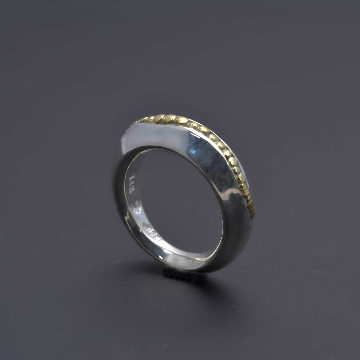 &quot;Golden Spheres: A Unique and Elegant Sterling Silver Ring with 14K Gold Accents&quot; - Nine Amulets 