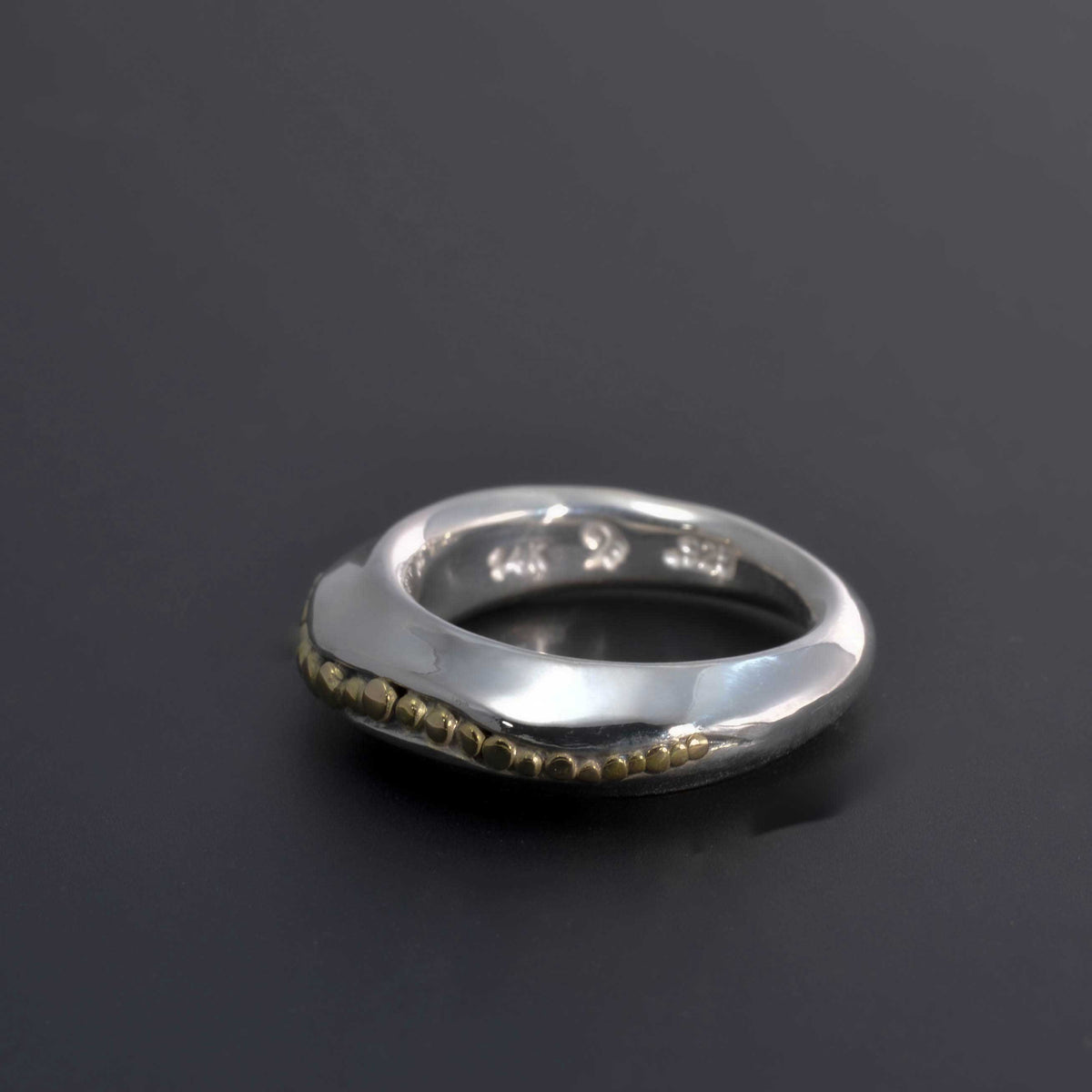 &quot;Golden Spheres: A Unique and Elegant Sterling Silver Ring with 14K Gold Accents&quot; - Nine Amulets 