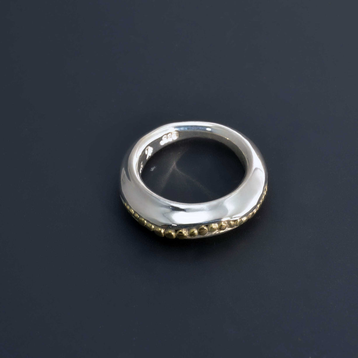 &quot;Golden Spheres: A Unique and Elegant Sterling Silver Ring with 14K Gold Accents&quot; - Nine Amulets 