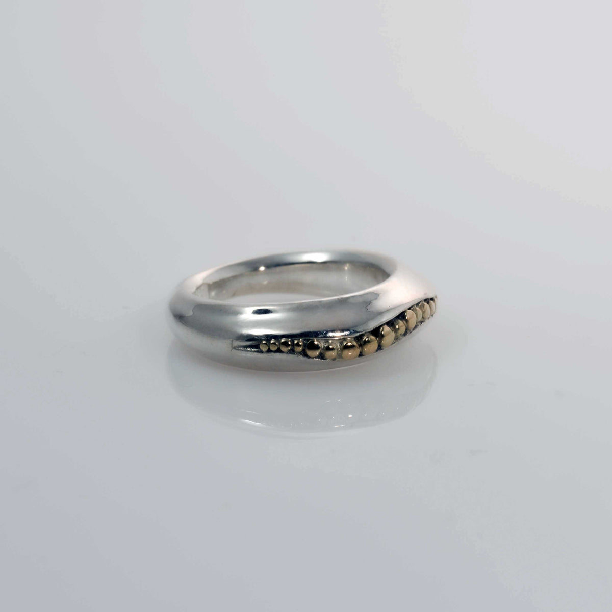 &quot;Golden Spheres: A Unique and Elegant Sterling Silver Ring with 14K Gold Accents&quot; - Nine Amulets 