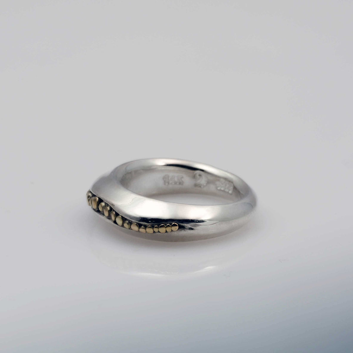 &quot;Golden Spheres: A Unique and Elegant Sterling Silver Ring with 14K Gold Accents&quot; - Nine Amulets 