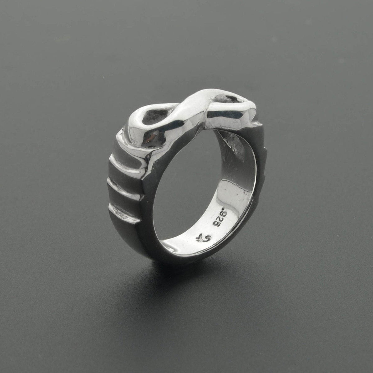 Unique infinity symbol sculpted ring
