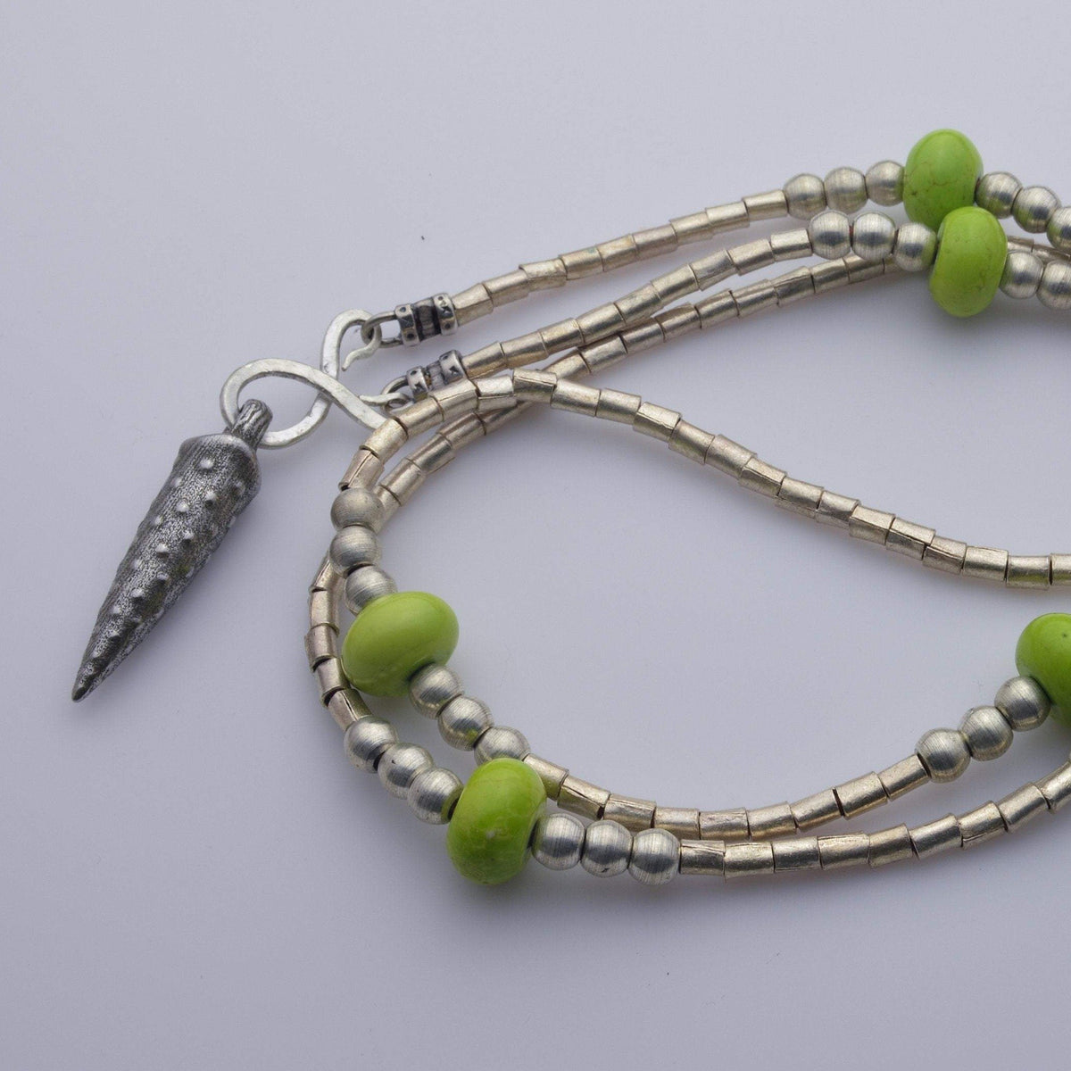 African beads with bullet iron pendant