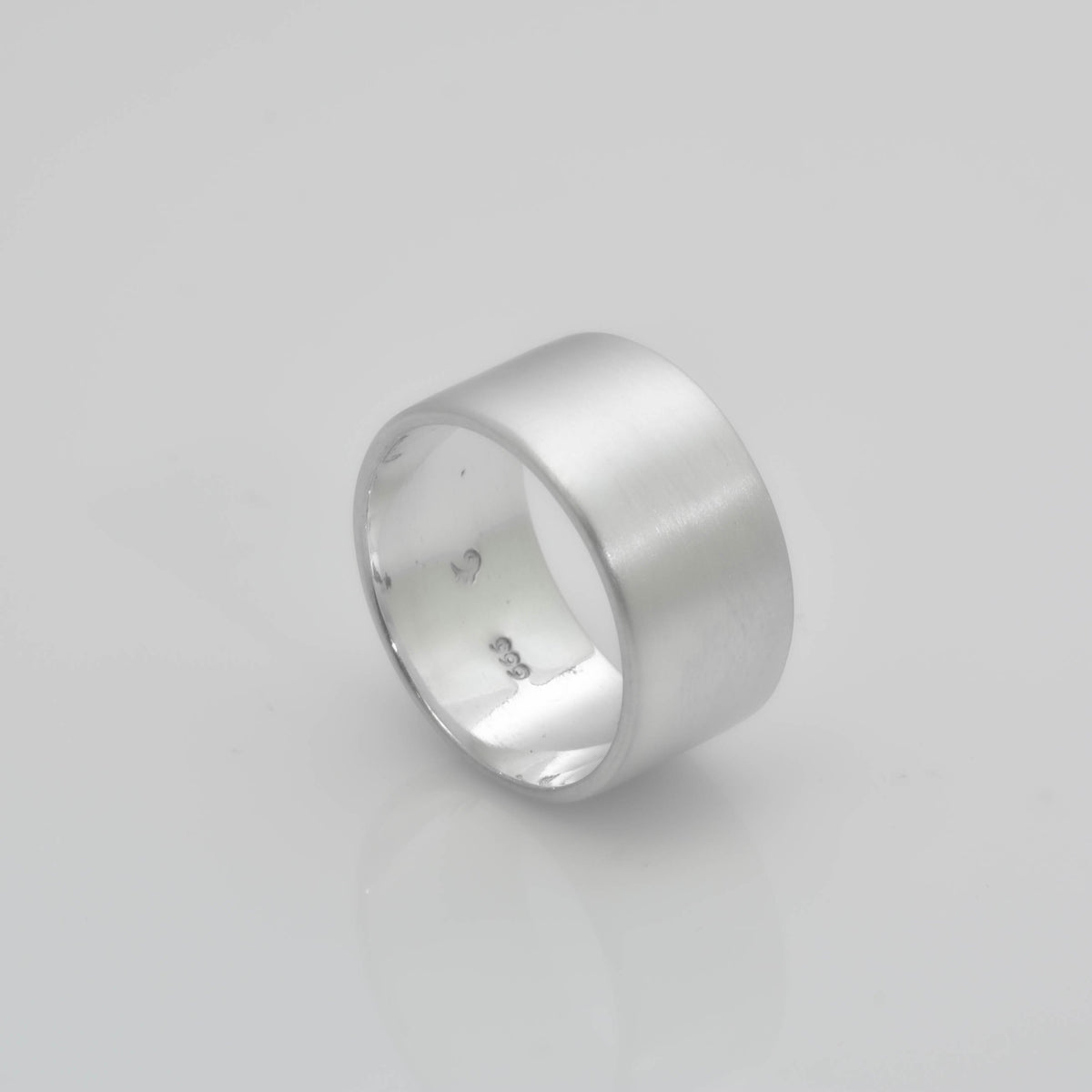 &quot;Echoes of Elegance: The Artisanal Sterling Silver Tube Ring - An Unparalleled Blend of Style, Substance, and Svelte Craftsmanship&quot; - Nine Amulets 