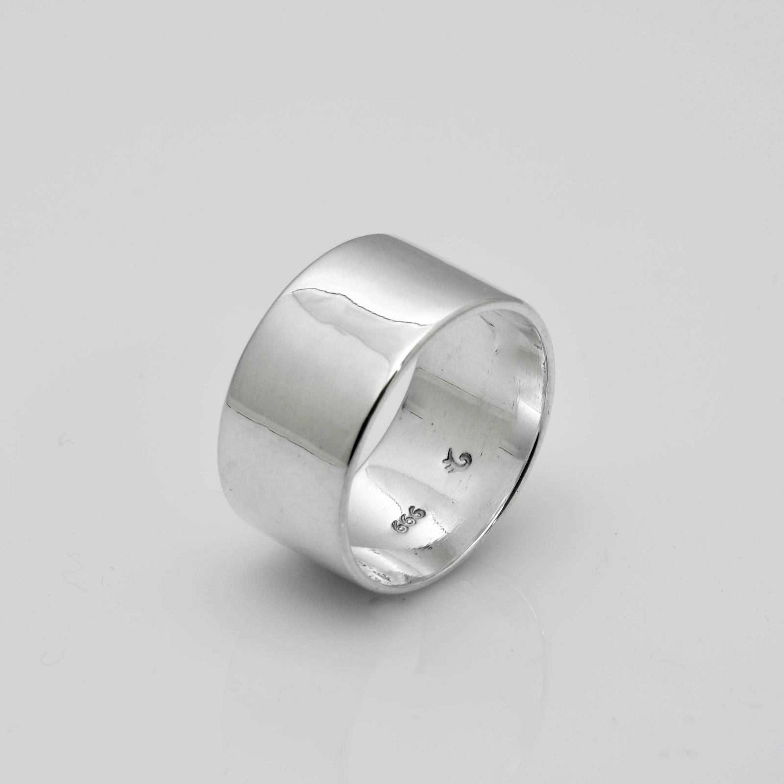 "Echoes of Elegance: The Artisanal Sterling Silver Tube Ring - An Unparalleled Blend of Style, Substance, and Svelte Craftsmanship" - Nine Amulets 