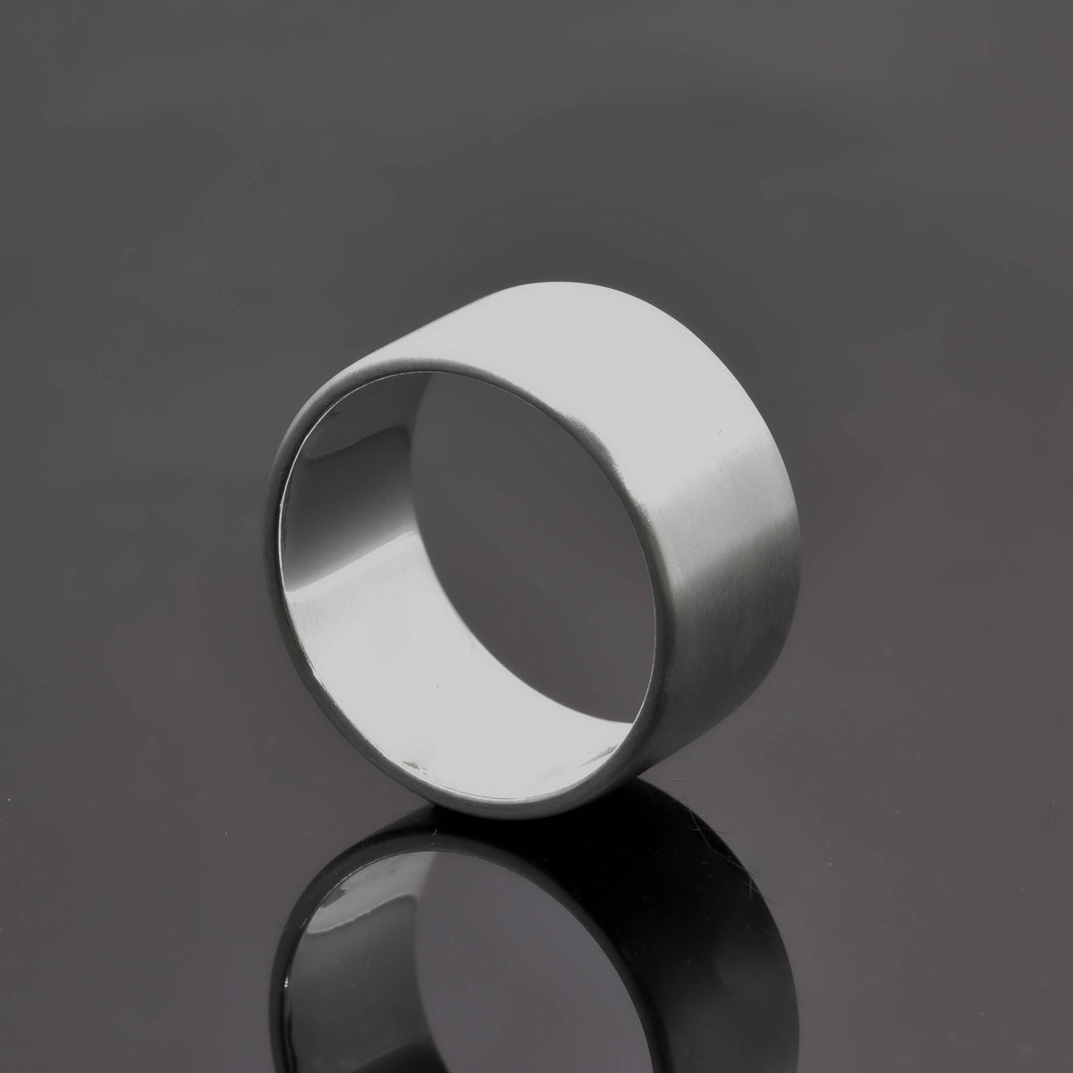 &quot;Echoes of Elegance: The Artisanal Sterling Silver Tube Ring - An Unparalleled Blend of Style, Substance, and Svelte Craftsmanship&quot; - Nine Amulets 