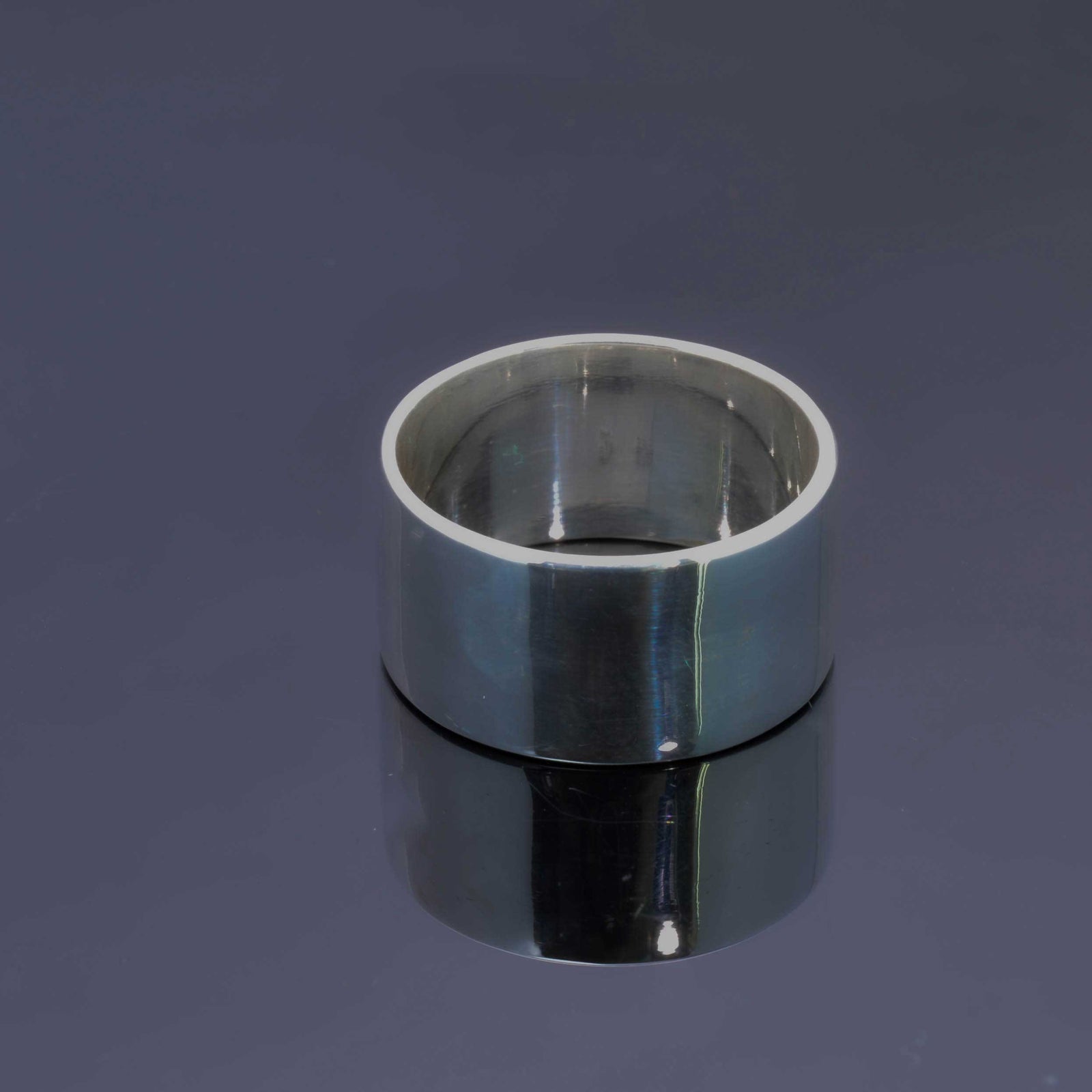 "Echoes of Elegance: The Artisanal Sterling Silver Tube Ring - An Unparalleled Blend of Style, Substance, and Svelte Craftsmanship" - Nine Amulets 