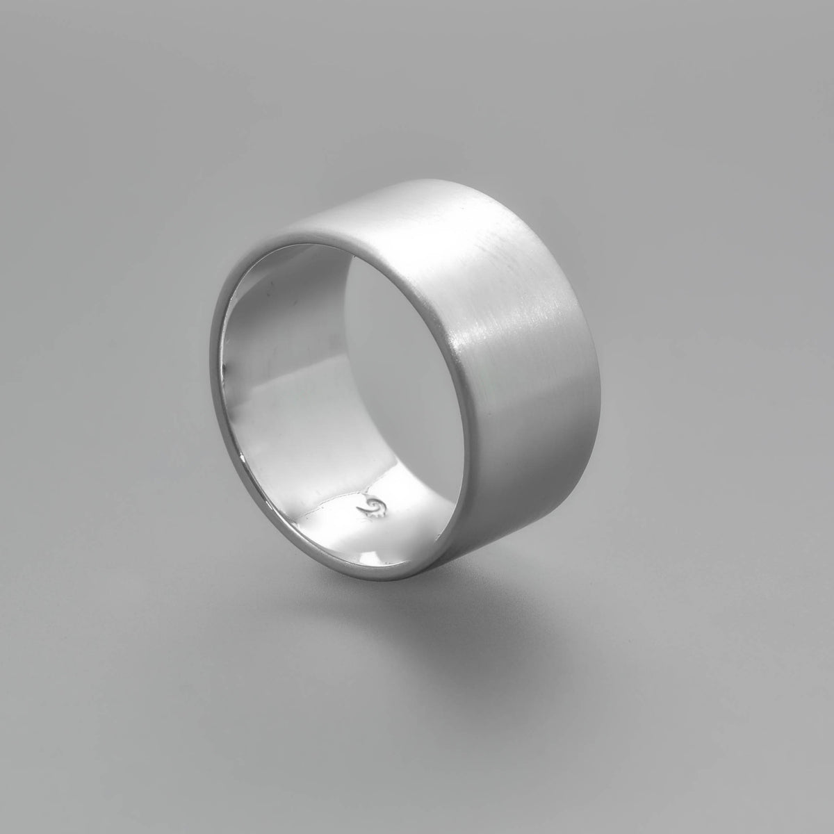 &quot;Echoes of Elegance: The Artisanal Sterling Silver Tube Ring - An Unparalleled Blend of Style, Substance, and Svelte Craftsmanship&quot; - Nine Amulets 