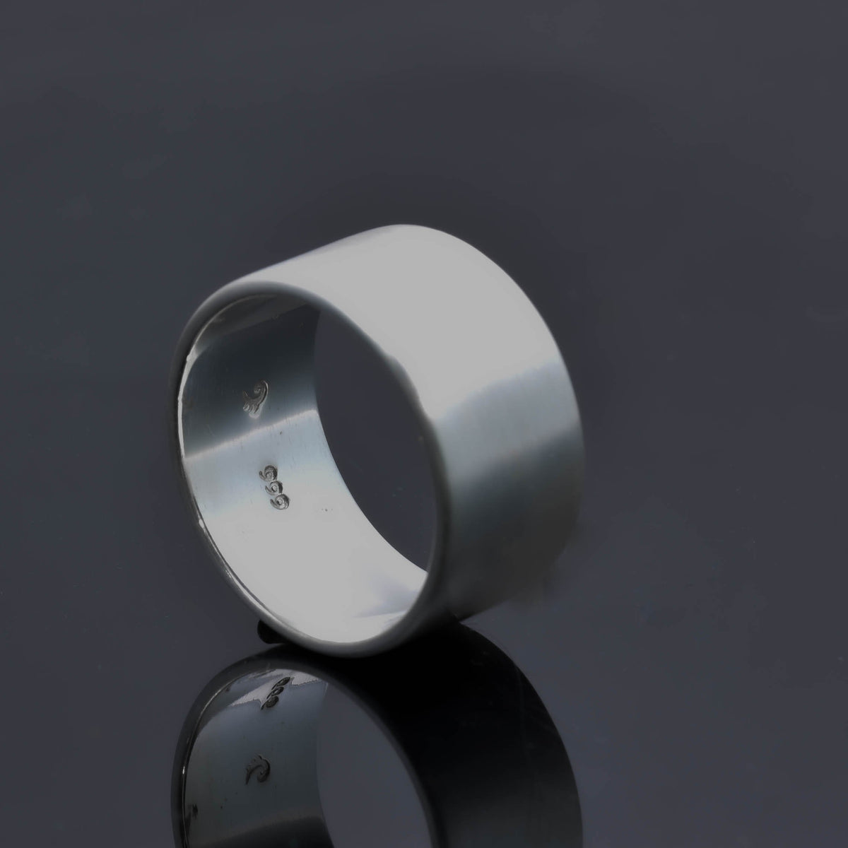 &quot;Echoes of Elegance: The Artisanal Sterling Silver Tube Ring - An Unparalleled Blend of Style, Substance, and Svelte Craftsmanship&quot; - Nine Amulets 