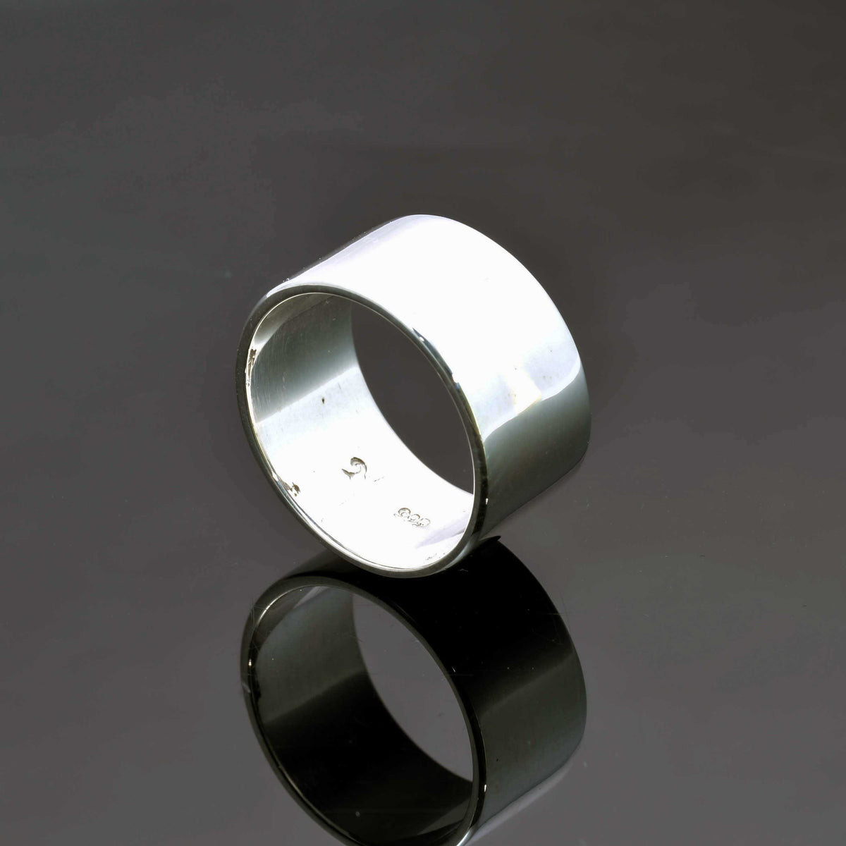 &quot;Echoes of Elegance: The Artisanal Sterling Silver Tube Ring - An Unparalleled Blend of Style, Substance, and Svelte Craftsmanship&quot; - Nine Amulets 