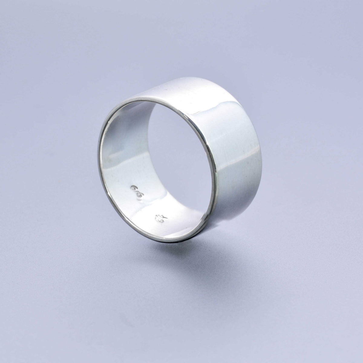 &quot;Echoes of Elegance: The Artisanal Sterling Silver Tube Ring - An Unparalleled Blend of Style, Substance, and Svelte Craftsmanship&quot; - Nine Amulets 