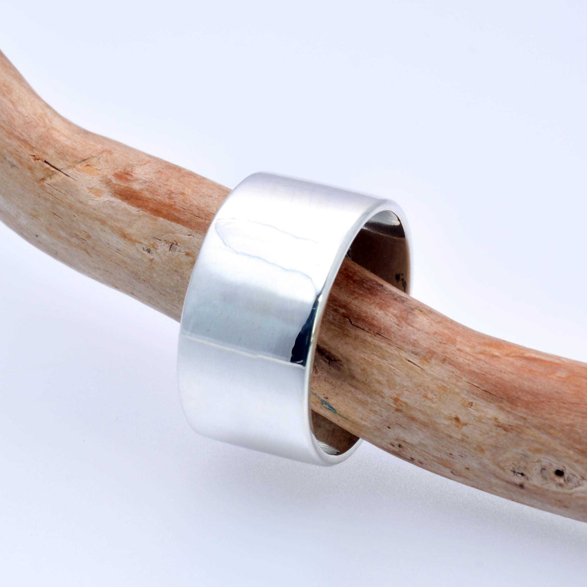 &quot;Echoes of Elegance: The Artisanal Sterling Silver Tube Ring - An Unparalleled Blend of Style, Substance, and Svelte Craftsmanship&quot; - Nine Amulets 