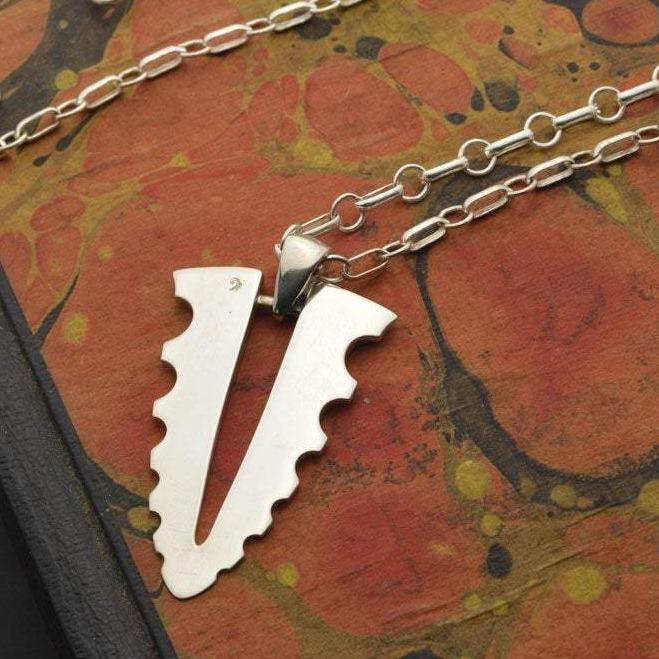 oval link silver chain and large pendant