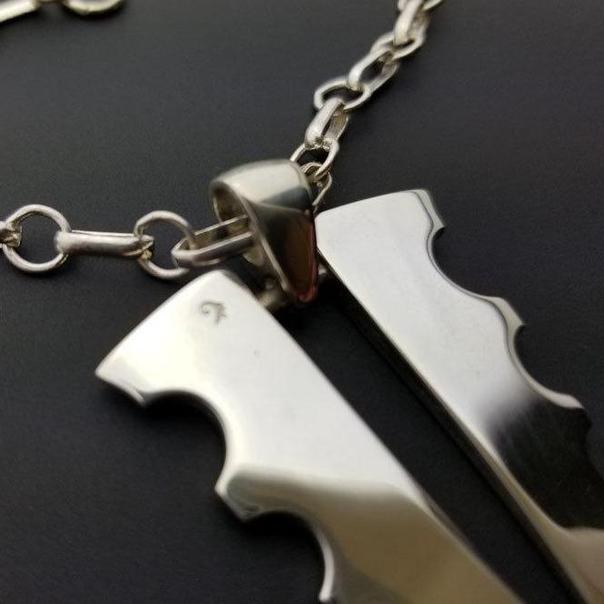 Silver arrowhead pendant
