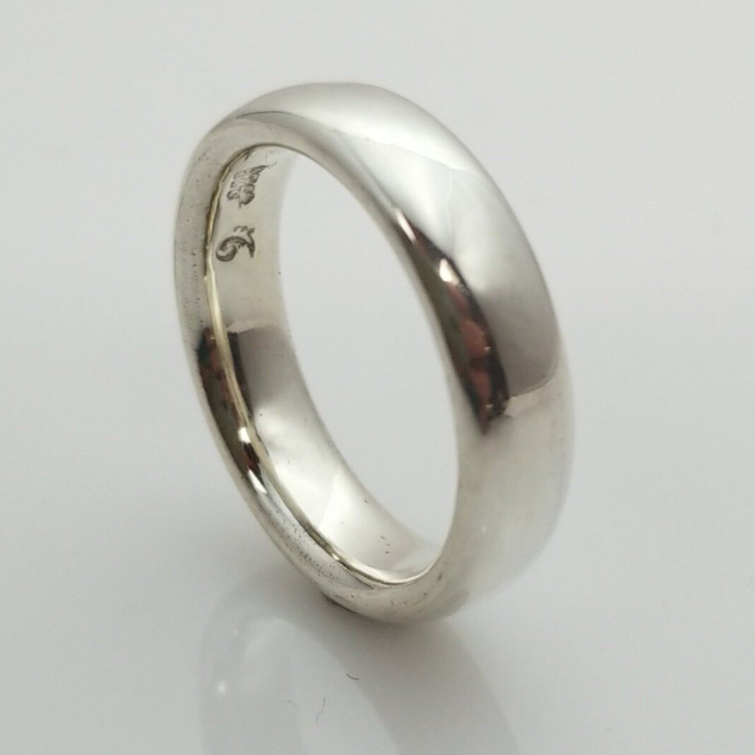 "New Moon Ring, Timeless Elegance: The Classic Solid Silver Wedding Band" - Nine Amulets 