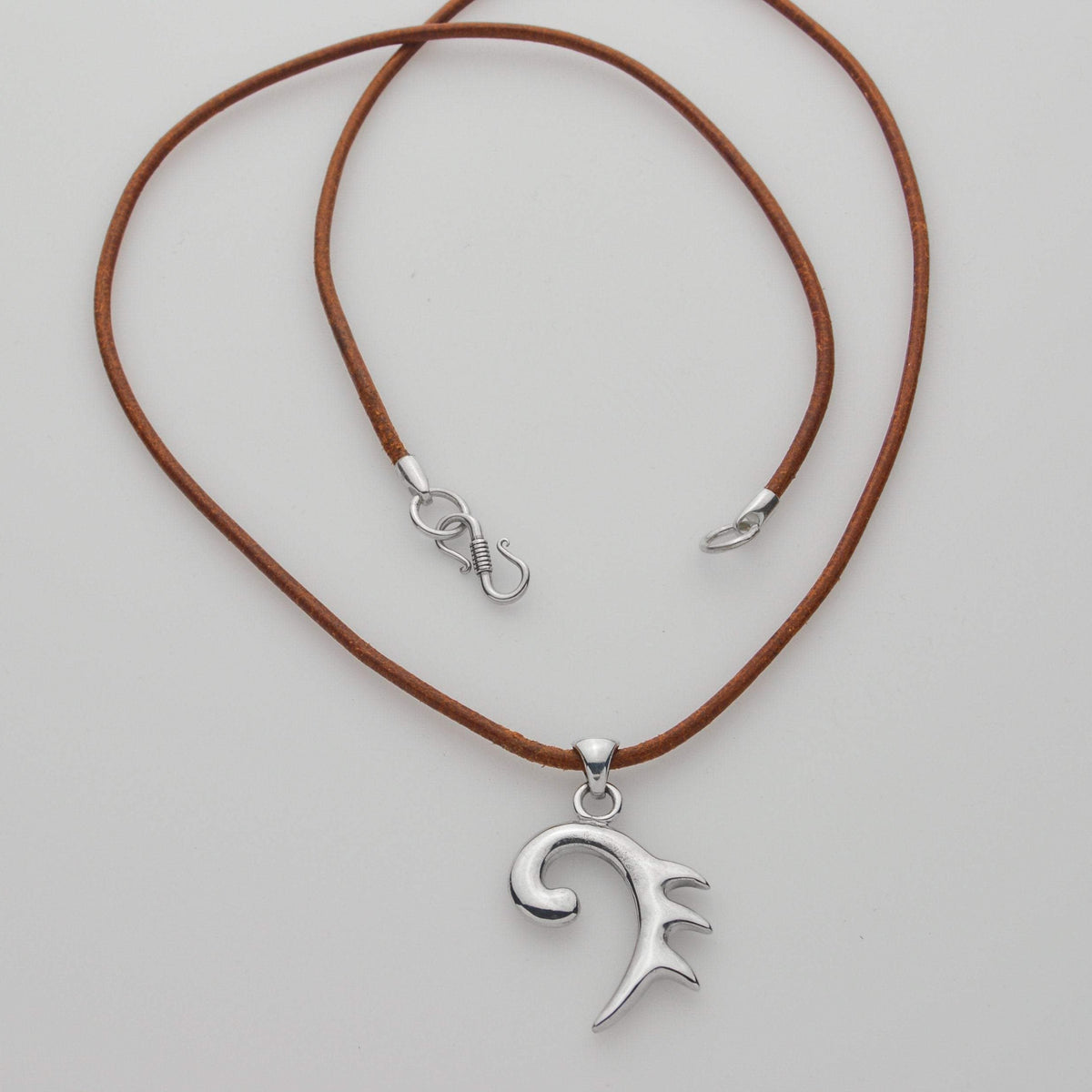 Nine amulets logo in a silver pendant