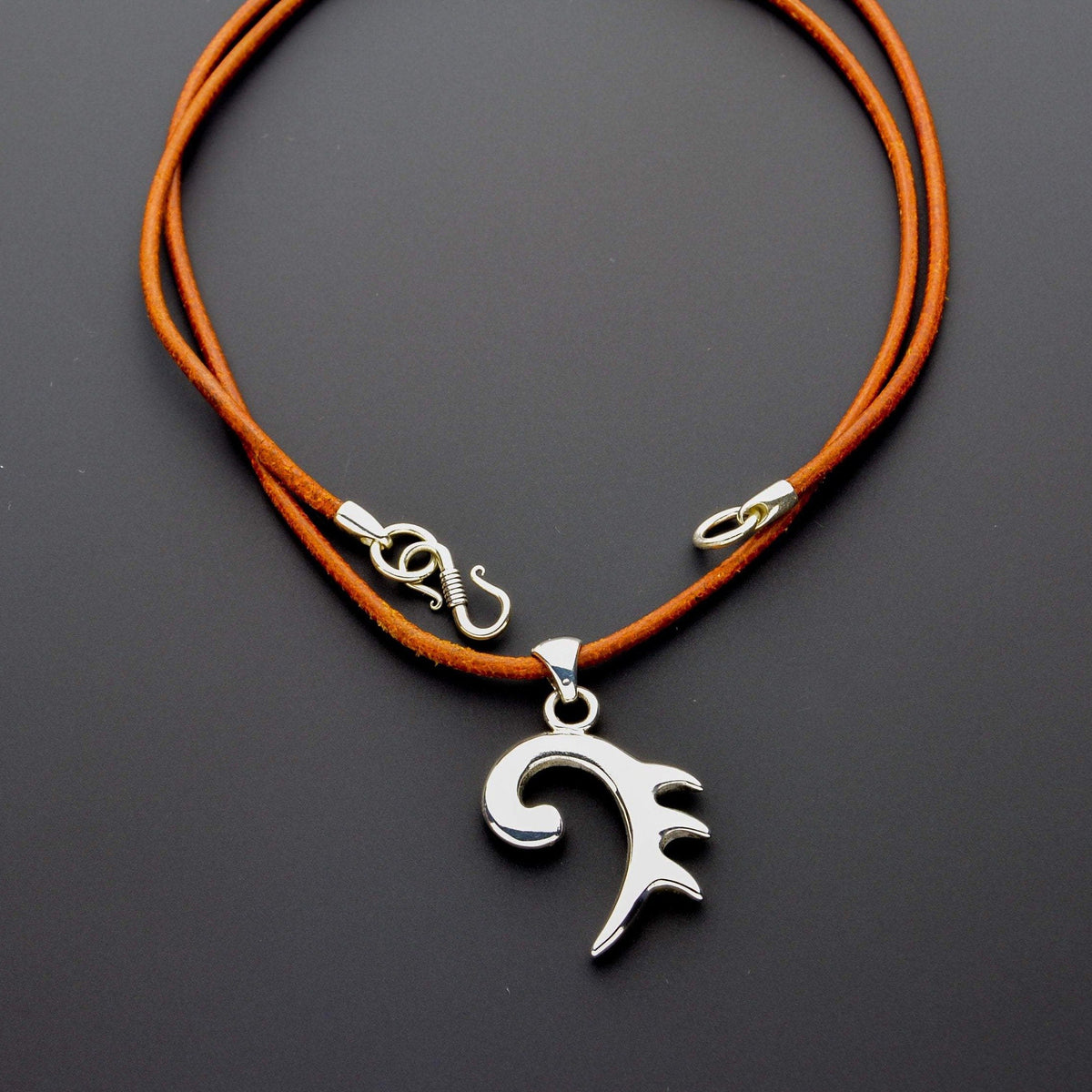 Nine amulets pendant and leather cord