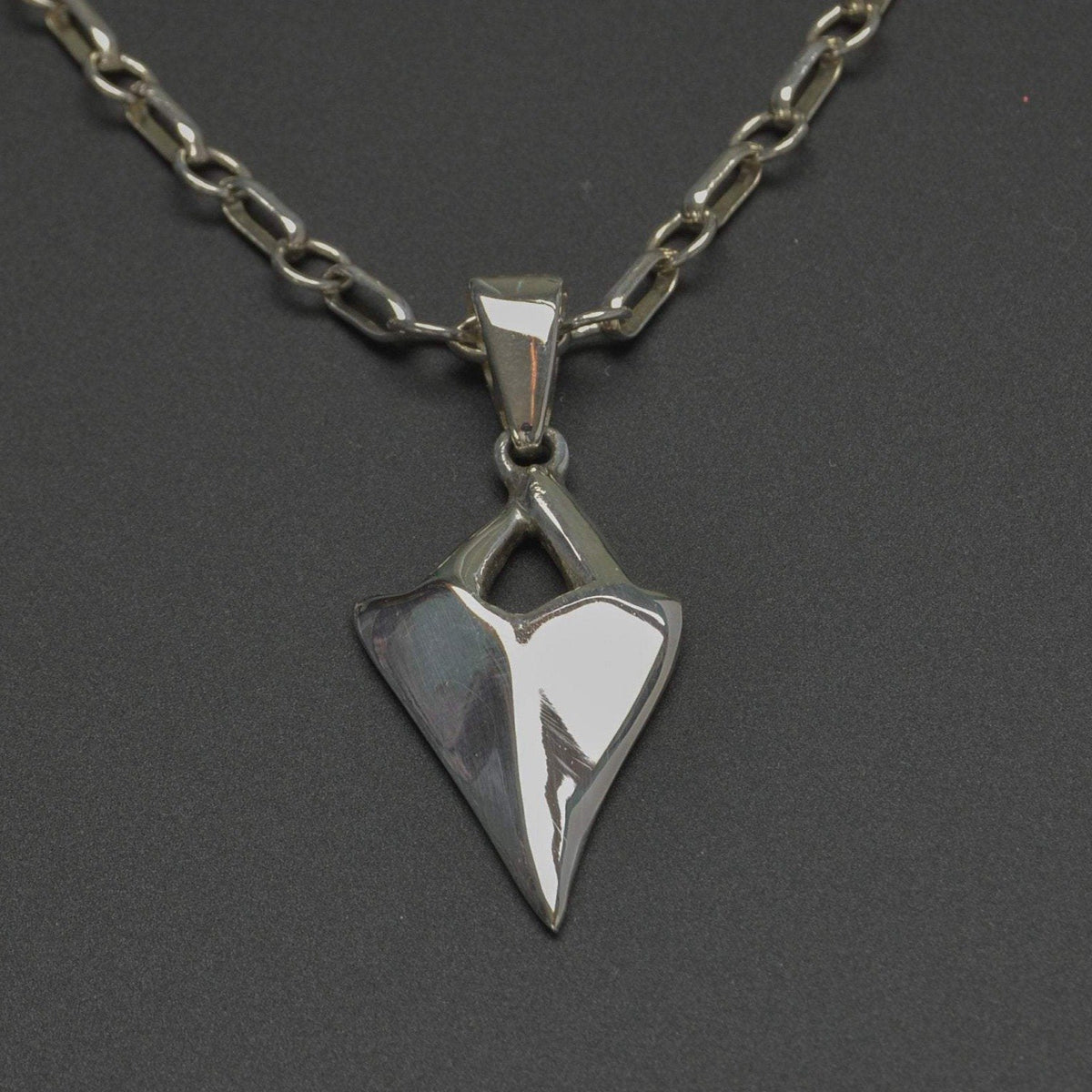 Highly polished silver shark tooth pendant