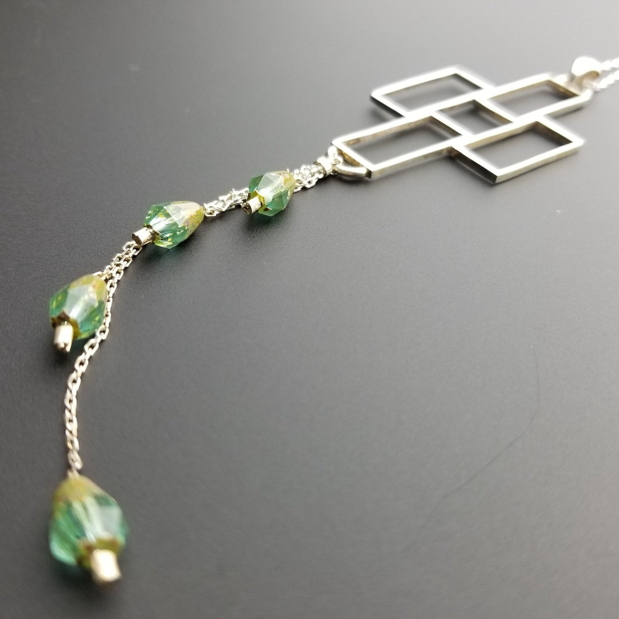 Emerald bead silver cross pendant