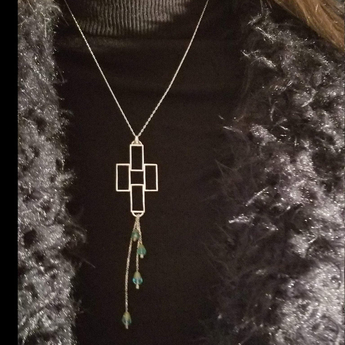 Cross with emerald bead drops and silver chain