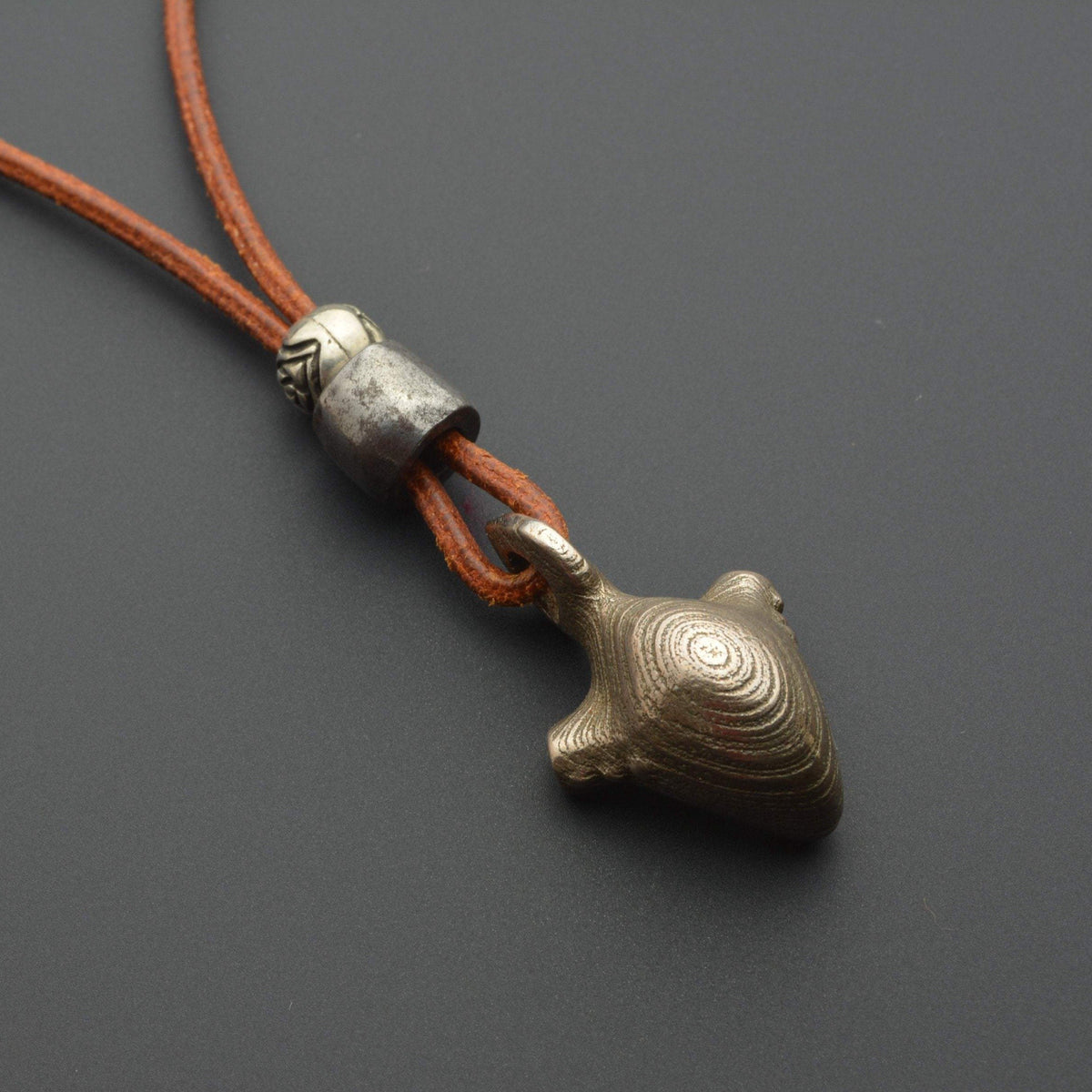 Iron pendant with leather cord