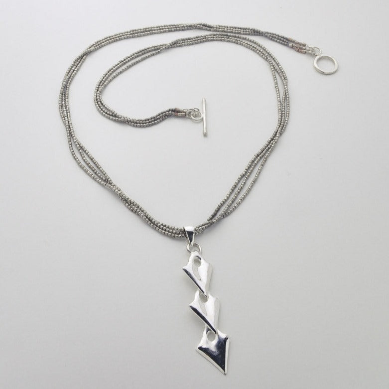 Silver arrowhead pendant black string necklace