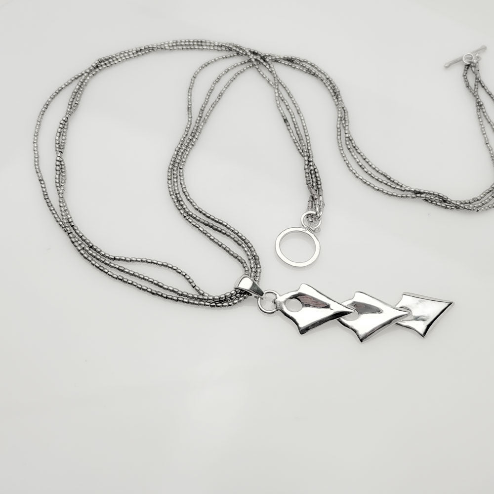 Unleash Your Inner Warrior with our Silver Arrowhead Triple Pendant Tribal Charm Necklace - Nine Amulets 