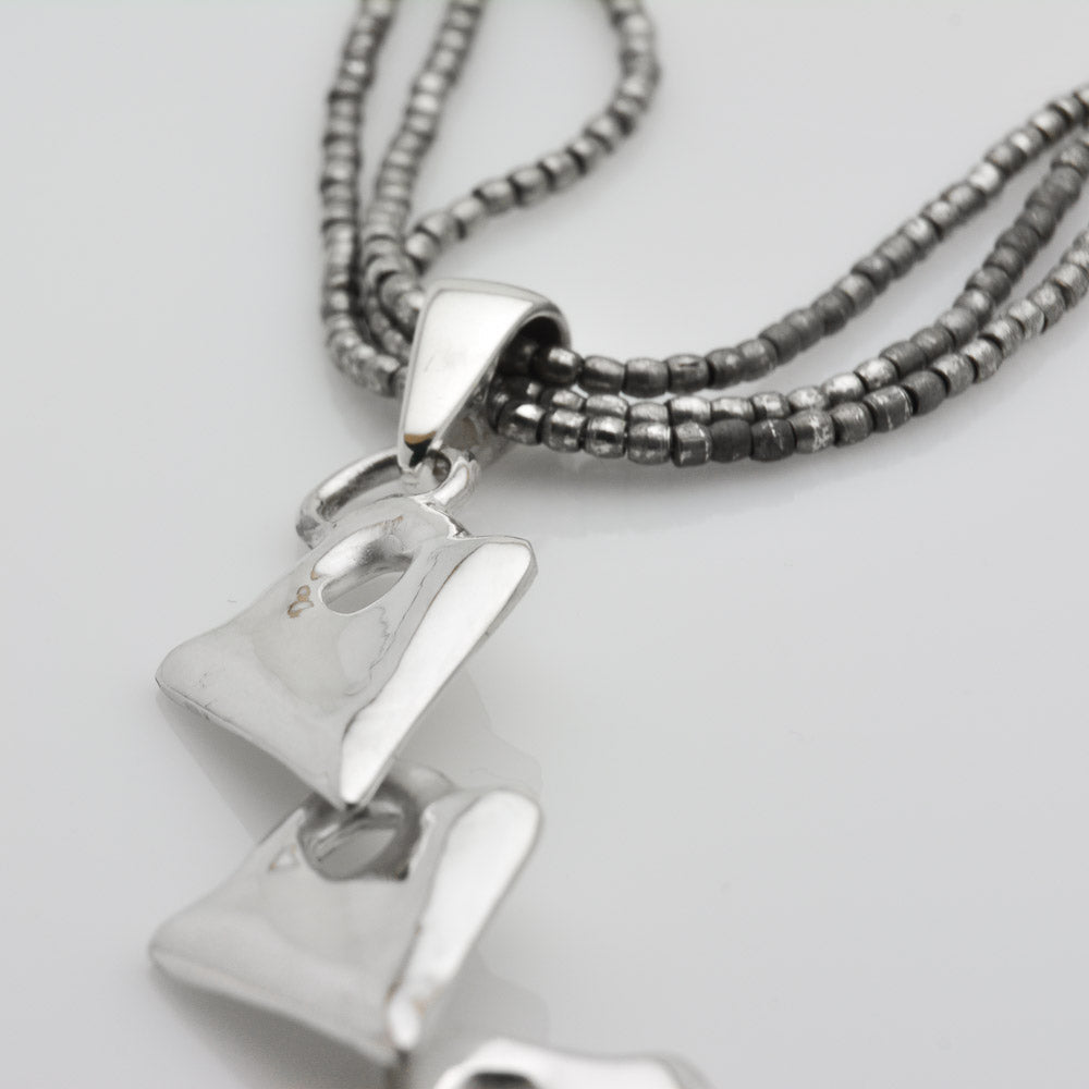 Unleash Your Inner Warrior with our Silver Arrowhead Triple Pendant Tribal Charm Necklace - Nine Amulets 