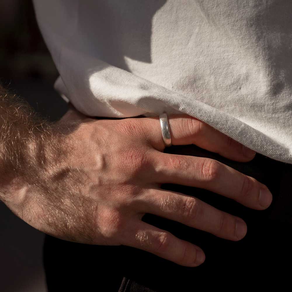 "New Moon Ring, Timeless Elegance: The Classic Solid Silver Wedding Band" - Nine Amulets 